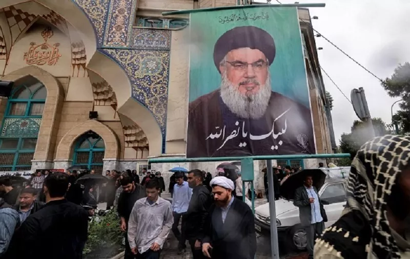 Demonstrators gather for an anti-Israel protest in Tehran's Palestine Square on September 28, 2024, after the Iran-backed Lebanese Hezbollah group confirmed reports of the killing of its leader Hassan Nasrallah in an Israeli air strike in Beirut the previous day. (Photo by ATTA KENARE / AFP)