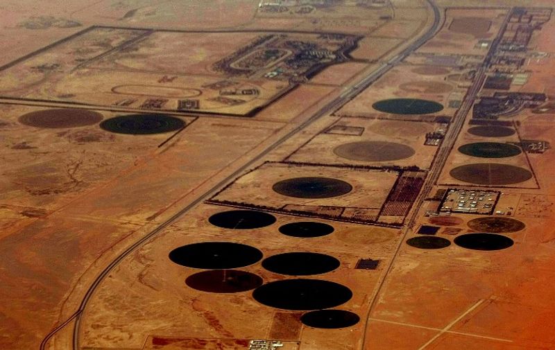 Farms in the shapes of circles (not oil fields) are seen in this aerial view of Saudi Saudi Arabia's desert near the oil-rich area of Khouris, 160 kms east of the capital Riyadh, on June 23, 2008. Oil producers are at war with speculators but they have been left speculating themselves over the future of their precious commodity after the weekend's unique summit, analysts said. Most experts agree the only concrete result was Saudi Arabia's announcement that it was increasing daily production by more than 200,000 barrels to 9.7 million -- and that it could significantly step this up if necessary.      AFP PHOTO/MARWAN NAAMANI / AFP / MARWAN NAAMANI