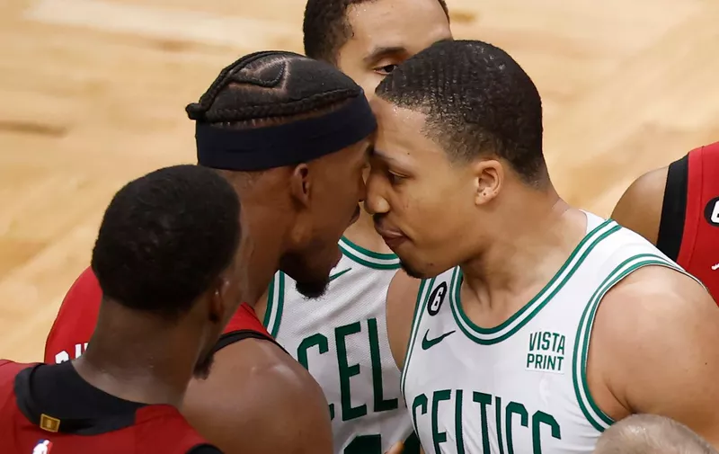 Miami Heat forward Jimmy Butler, center left, has words with Boston Celtics forward Grant Williams, center right, during the second half of Game 2 of the NBA basketball playoffs Eastern Conference finals in Boston, Friday, May 19, 2023. (AP Photo/Michael Dwyer)