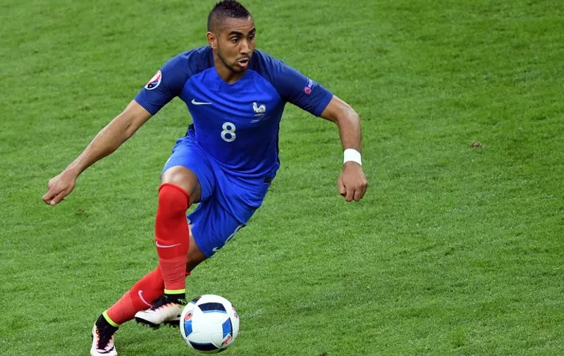 Dimitri Payet of France in action during the Group A soccer match of the UEFA EURO 2016 between France and Romania at the Stade de France in St. Denis, France, 10 June 2016. Photo: Marius Becker/dpa (RESTRICTIONS APPLY: For editorial news reporting purposes only. Not used for commercial or marketing purposes without prior written approval of UEFA. Images must appear as still images and must not emulate match action video footage. Photographs published in online publications (whether via the Internet or otherwise) shall have an interval of at least 20 seconds between the posting.)