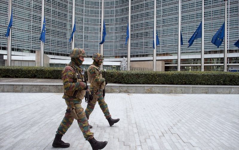 Security forces patrol the area in front of the European Commission building in Brussels, Belgium, 22 March 2016. At least 26 people have been killed on the same day in a new series of terror attacks that rocked Brussels, Belgium, and left more than 130 people injured. Photo: FEDERICO GAMBARINI/dpa