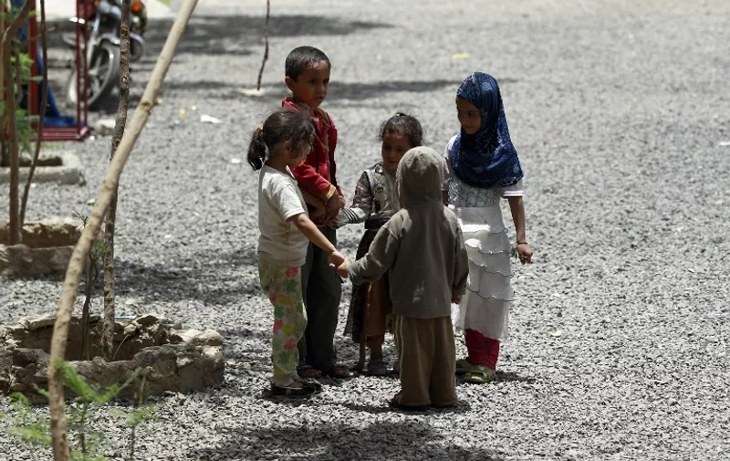 TOPSHOTS
Yemeni displaced children, who fled Saada province due to fighting between Shiite Huthi rebels and forces loyal to Yemen's exiled President Abedrabbo Mansour Hadi, play at a school turned into a shelter in the capital Sanaa on August 19, 2015. The United Nations says nearly 4,000 people have been killed since March 2015, half of them civilians, while 80 percent of Yemen's 21 million people need aid and protection. The International Committee of the Red Cross (ICRC) says 1.3 million Yemenis have been displaced by the conflict. AFP PHOTO / MOHAMMED HUWAIS