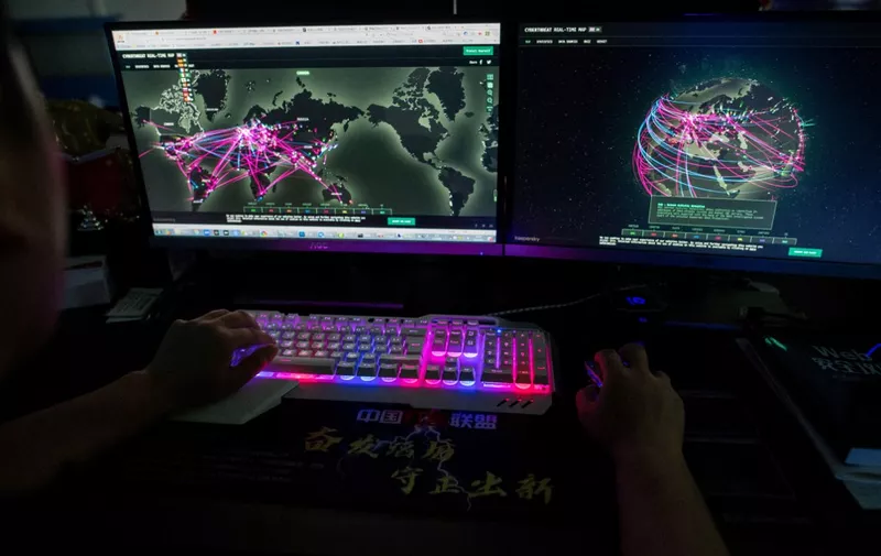 This photo taken on August 4, 2020 shows Prince, a member of the hacking group Red Hacker Alliance who refused to give his real name, using a website that monitors global cyberattacks on his computer at their office in Dongguan, China's southern Guangdong province. From a small, dingy office tucked away in an industrial city in southern China, one of China's last "volunteer hacker" groups maintains a final outpost in its patriotic hacking war. (Photo by NICOLAS ASFOURI / AFP) / TO GO WITH China-hacking-security,FOCUS by Laurie Chen / The erroneous mention[s] appearing in the metadata of this photo by NICOLAS ASFOURI has been modified in AFP systems in the following, we removed the HOLD HOLD HOLD in the main caption.   Please immediately remove the erroneous mention[s] from all your online services and delete it (them) from your servers. If you have been authorized by AFP to distribute it (them) to third parties, please ensure that the same actions are carried out by them. Failure to promptly comply with these instructions will entail liability on your part for any continued or post notification usage. Therefore we thank you very much for all your attention and prompt action. We are sorry for the inconvenience this notification may cause and remain at your disposal for any further information you may require.