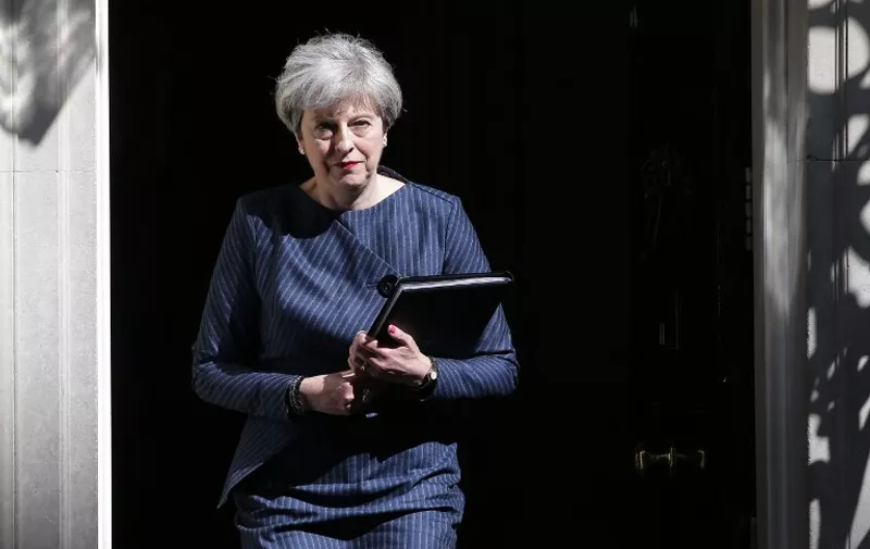 British Prime Minister Theresa May walks out of 10 Downing Street to make a statement to the media in central London on April 18, 2017.
British Prime Minister Theresa May called today for an early general election on June 8 in a surprise announcement as Britain prepares for delicate negotiations on leaving the European Union. / AFP PHOTO / Daniel LEAL-OLIVAS