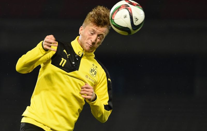 Forward Marco Reus of Germany's football club Borussia Dortmund heads a ball during a training session after their arrival in Japan in Kawasaki, suburb of Tokyo on July 6, 2015.  Borussia Dortmund will play a friendly match with Japan's club Kawasaki Frontale on July 7.     AFP PHOTO / Toru YAMANAKA