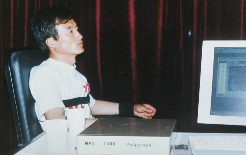 This undated photograph shows Meng Zhaoguo, a rural worker from northeast China's Wuchang city, taking a lie detector test in Beijing.  Meng says he was 29 years old when he broke his marital vows for the first and only time -- with a female extraterrestrial of unusually robust build. A growing number of people in the world's most populous nation believe in unidentified flying objects, or UFOs, and while officially registered UFO associations in China have about 50,000 members, some estimate the actual number of Chinese interested in the subject is probably in the tens of millions.  The International Chinese UFO Association will hold an international meeting on UFO research in the northern port city of Dalian in September this year. AFP PHOTO