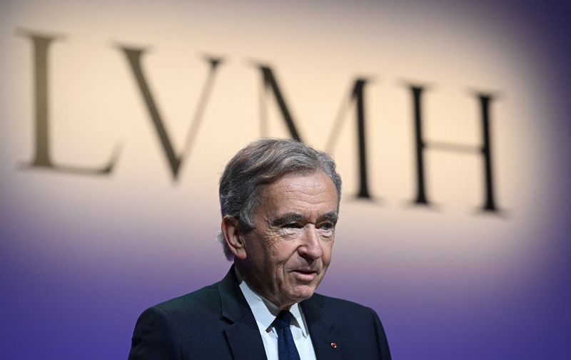 LMVH head Bernard Arnault announces the group's 2022 results at the LVMH headquarters in Paris on January 26, 2023. The world's top luxury group LVMH said that its sales and net profit both hit new heights last year, driven by strong demand in Europe and the United States. Sales came in at 79 billion euros ($86 billion) and net profit at 14 billion euros for 2022 -- both new records for the group, whose brands include Bulgari, Givenchy, Louis Vuitton, and TAG Heuer. (Photo by Stefano Rellandini / AFP)