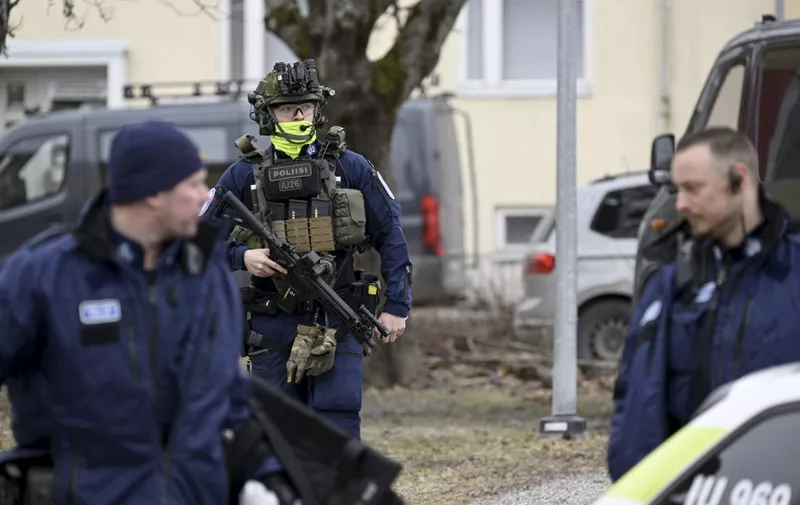 Finnish police officers investigate at the primary Viertola comprehensive school where a child opened fire and injured three other children, on April 2, 2024 in Vantaa, outside the Finnish capital Helsinki. Police said, that the attacker was in custody, and "All those involved in the shooting incident are minors". (Photo by Markku Ulander / Lehtikuva / AFP) / Finland OUT