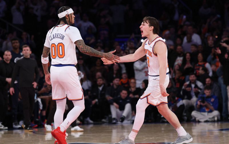 Dec 25, 2025; New York, New York, USA; New York Knicks guard Tyler Kolek (13) celebrates with guard Jordan Clarkson (00) after a stoppage in play during the second half against the Cleveland Cavaliers at Madison Square Garden. Mandatory Credit: Vincent Carchietta-Imagn Images