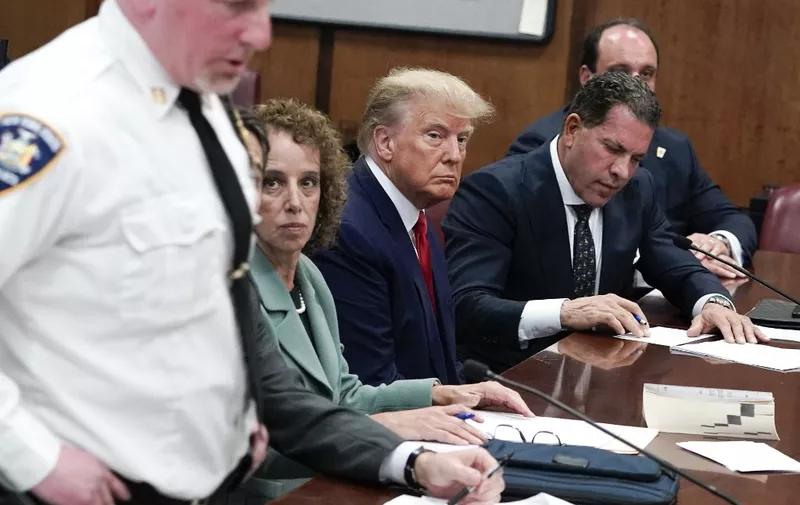 Former US president Donald Trump appears in court at the Manhattan Criminal Court in New York on April 4, 2023. - Former US president Donald Trump arrived for a historic court appearance in New York on Tuesday, facing criminal charges that threaten to upend the 2024 White House race. (Photo by Seth WENIG / POOL / AFP)