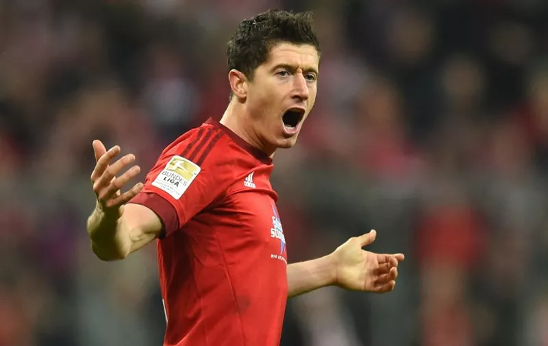 Bayern Munich's Polish striker Robert Lewandowski celebrates scoring during the German first division Bundesliga football match FC Bayern Munich vs FC Ingolstadt 04 in Munich, southern Germany, on December 12, 2015. AFP PHOTO / CHRISTOF STACHE

RESTRICTIONS: DURING MATCH TIME: DFL RULES TO LIMIT THE ONLINE USAGE TO 15 PICTURES PER MATCH AND FORBID IMAGE SEQUENCES TO SIMULATE VIDEO. 
==RESTRICTED TO EDITORIAL USE ==
FOR FURTHER QUERIES PLEASE CONTACT THE DFL DIRECTLY AT + 49 69 650050. / AFP / CHRISTOF STACHE