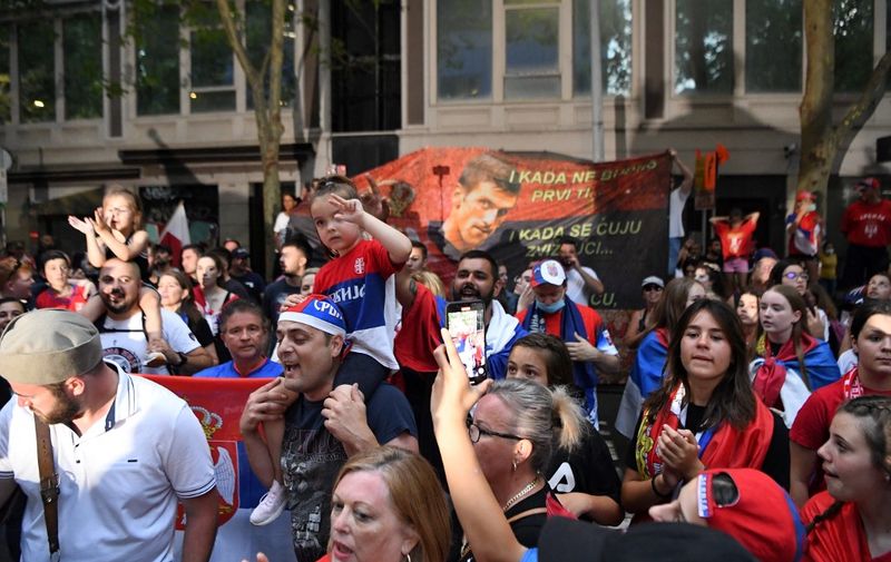 Members of the local Serbian community play music and dance outside the legal offices where Serbia's tennis champion Novak Djokovic is in with his legal team in Melbourne on January 9, 2022. (Photo by William WEST / AFP)