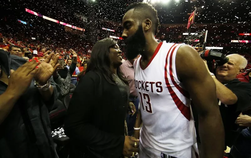 HOUSTON, TX - MAY 17: James Harden #13 of the Houston Rockets celebrates with his mother Monja Willis after they defeated the Los Angeles Clippers 113 to 100 during Game Seven of the Western Conference Semifinals at the Toyota Center for the 2015 NBA Playoffs on May 17, 2015 in Houston, Texas. NOTE TO USER: User expressly acknowledges and agrees that, by downloading and/or using this photograph, user is consenting to the terms and conditions of the Getty Images License Agreement.   Scott Halleran/Getty Images/AFP