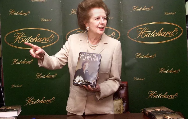 Former British prime minister Baroness Margaret Thatcher holds a copy of her latest book 'Statecraft' 03 April 2002 at a signing session at Hatchards in Piccadilly, London. AFP PHOTO Hugo PHILPOTT