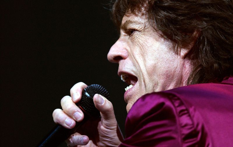 Mick Jagger of the Rolling Stones performs in Boston. Jagger will celebrate his 60th birthday on July 26, 2003.,Image: 423573206, License: Rights-managed, Restrictions: , Model Release: no