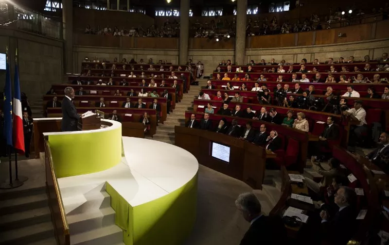 Former UN Secretary General Kofi Annan delivers a speech during the opening of the Paris Summit of Conscience for the Climate, on July 21, 2015, at the Economic, Social and Environmental Council (CESE) in Paris. Hollande hosts 40 global figures on July 21, including former UN Secretary General Kofi Annan, for a conference to launch an appeal against climate change, five months ahead of a crunch climate summit in Paris. AFP PHOTO/ POOL / ETIENNE LAURENT
