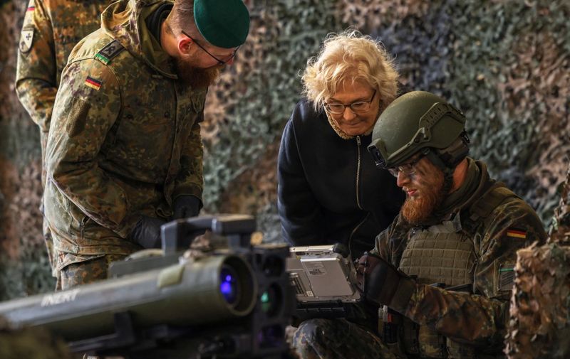 German Defence Minister Christine Lambrecht listens to explanations about the anti tank system MELLS that is used with the armoured "Marder" vehicle during her visit at the military base of an armored infantryman batallion in Marienberg, eastern Germany, on January 12, 2023. - Germany will supply Ukraine with about 40 Marder infantry fighting vehicles within weeks as part of a new phase of support coordinated with the US. (Photo by Odd ANDERSEN / AFP)