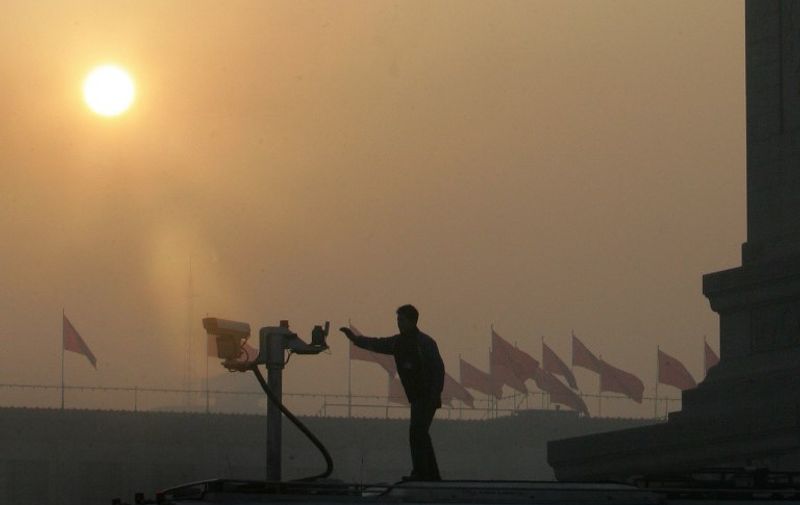 A security camera is set up at sunrise overlooking Tiananmen Square amid tight security for the opening session of the National People's Congress (NPC) in Beijing, 05 March 2006, where Chinese Premier Wen Jiabao listed the plight of the nation's rural poor and the fast-rising wealth gap as top national priorities. Delivering the government's work report at the start of the 10-day session, Wen cautioned there were serious imbalances in the nation's rapidly growing economy that needed to be urgently addressed, yet China's military budget will increase almost 15 percent this year to 35 billion USD, amid warnings that Taiwan's "secessionist forces" were moving towards independence.   AFP PHOTO/Frederic J. BROWN / AFP PHOTO / FREDERIC J. BROWN