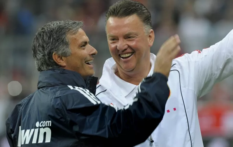 Real Madrid's Portuguese coach Jose Mourinho (L) and Bayern Munich's Dutch coach Louis van Gaal share a laugh before a friendly match between German first football division Bundesliga club FC Bayern Munich and Spanish team Real Madrid in Munich, southern Germany, August 13, 2010. Real Madrid won the match 4-2 after a penalty shootout. The match was organised to honor former Bayern Munich President Franz Beckenbauer.  AFP PHOTO / CHRISTOF STACHE / AFP / CHRISTOF STACHE