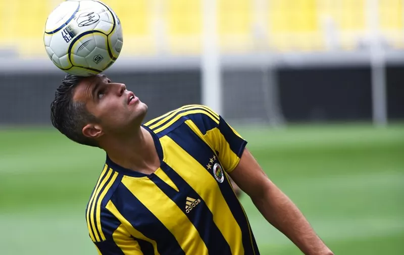 Manchester Uniteds international striker Dutch Robin Van Persie juggles with the ball after signing a contract with the Turkish Super Lig giants football club Fenerbahce at the Sukru Saracoglu stadium in Istanbul on July 14, 2015. The Dutch international is believed to have put pen to paper on a three-year deal worth 4.7 million euros (£3.4m, $5.2m) although financial details have yet to be disclosed.
 AFP PHOTO/ OZAN KOSE
