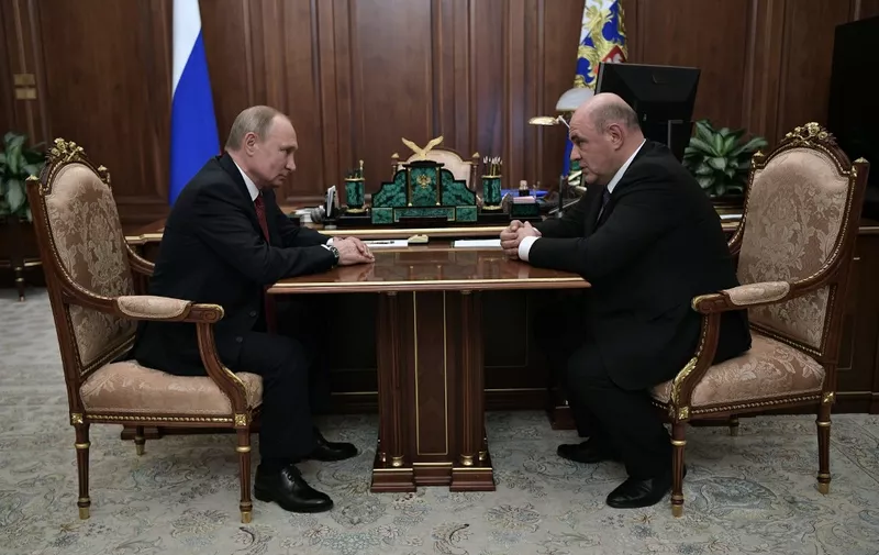 Russian President Vladimir Putin meets with Russia's Tax Service chief Mikhail Mishustin in Moscow on January 15, 2020. - President Vladimir Putin on Wednesday formally proposed the head of Russia's tax service Mikhail Mishustin for the post of prime minister, news agencies reported. (Photo by Alexey NIKOLSKY / SPUTNIK / AFP)
