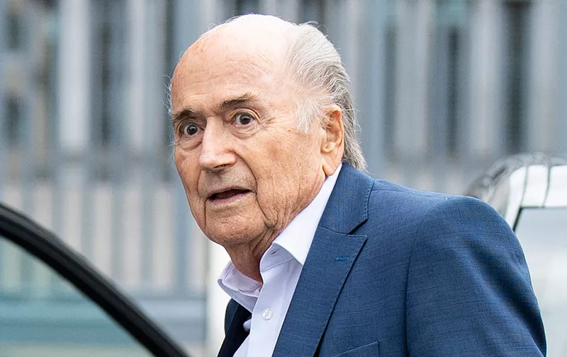 Former FIFA President Sepp Blatter, center, appears in front of the building of the Office of the Attorney General of Switzerland, on Tuesday, Sept.1, 2020, in Bern, Switzerland. Sepp Blatter and former UEFA president Michel Platini each face interrogation from the Swiss public prosecutor as part of the proceedings opened in 2015 over a payment of 2 million Swiss francs. (Peter Schneider/Keystone via AP)