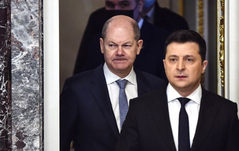 German Chancellor Olaf Scholz (L) and Ukrainian President Volodymyr Zelensky (R) arrive to hold a joint press conference in Kyiv on February 14, 2022. - Scholz landed in Kyiv for crisis talks with Zelensky, ahead of a visit to Moscow to head off what Berlin said was the "very critical" threat of a Russian invasion of Ukraine. (Photo by SERGEI SUPINSKY / AFP)