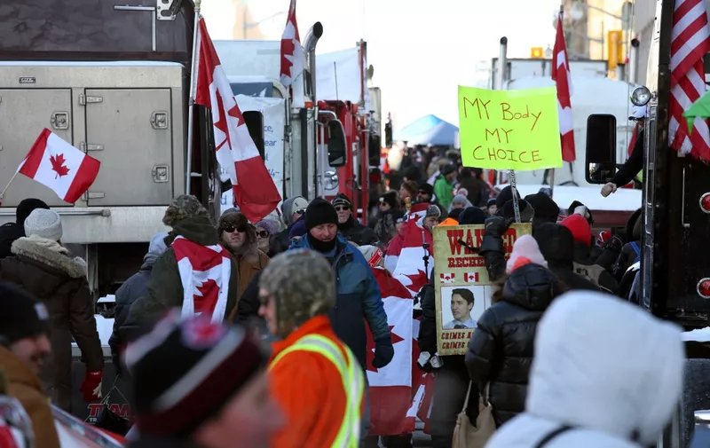Truckers and supporters continue to protest against mandates and restrictions related to Covid-19 vaccines in Ottawa, Ontario, Canada, on February 5, 2022. - Protesters again poured into Toronto and Ottawa early on February 5 to join a convoy of truckers whose occupation of Ottawa to denounce Covid vaccine mandates is now in its second week. (Photo by Dave Chan / AFP)