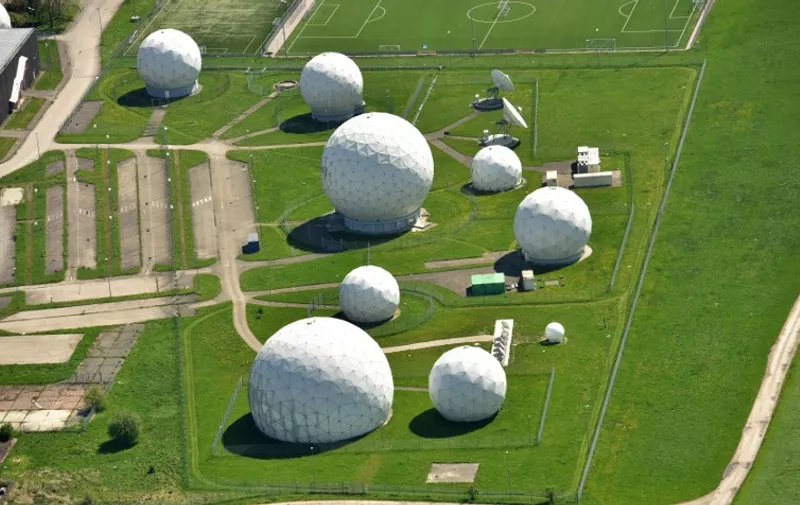 Aerial view taken on May 8, 2015 shows radar domes on the grounds of the German intelligence service BND's post in Bad Aibling, southern Germany. The German intelligence service BND (Bundesnachrichtendiesnt) is accused of helping the United States spy on EU leaders and companies from the post in Bad Aibling.      AFP PHOTO / DPA / PETER KNEFFEL    +++   GERMANY OUT