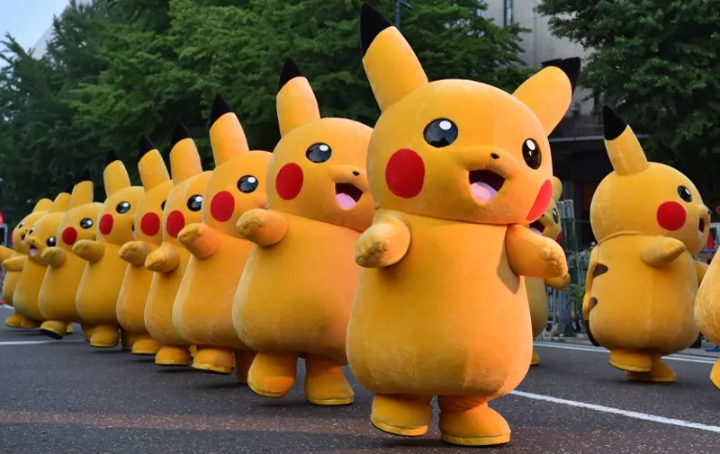 (FILES) This file picture taken on August 2, 2015 shows costumed performers dressed as Pikachu, the popular animation Pokemon series character, attending a promotional event at the Yokohama Dance Parade in Yokohama.

Nintendo shot past Sony in market value on July 19, 2016 after the videogame giant's stock more than doubled since the release of the wildly popular Pokemon Go game.  / AFP PHOTO / KAZUHIRO NOGI