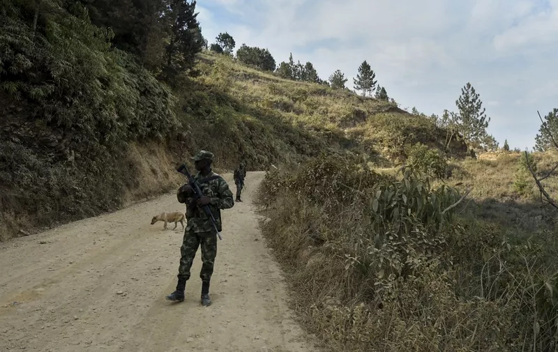 Police officers stand guard on a road near the area where mayoral candidate Karina Garcia and five others were shot and killed, in a rural area of Suarez, Cauca Department, Colombia, on September 2, 2019. An armoured car carrying all six was hit by long-range weapons and later set on fire in the attack on Sunday night in southwest Cauca department, the regional ombudsman Jair Rossi told AFP. Karina Garcia was running for mayor of the town of Suarez in October elections. The other fatalities included her mother and the city council candidate. (Photo by Luis ROBAYO / AFP)