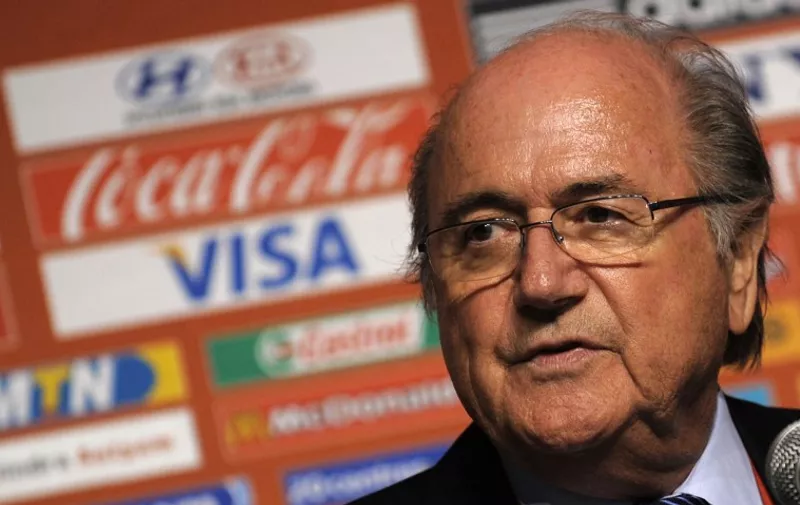 (FILE) FIFA President Sepp Blatter speaks at an Extraordinary Executive Committee meeting press conference in Cape Town, South Africa, on December 2, 2009. Top FIFA sponsors joined forces to demand Sepp Blatter's immediate resignation on October 2, 2015, dealing a fresh bodyblow to the scandal-tainted world football chief even as he vowed to cling to power. In separate statements issued one week after criminal proceedings were launched against Blatter in Switzerland, Coca-Cola, McDonald's and Visa all called on the 79-year-old to step down.   AFP PHOTO / GIANLUIGI GUERCIA