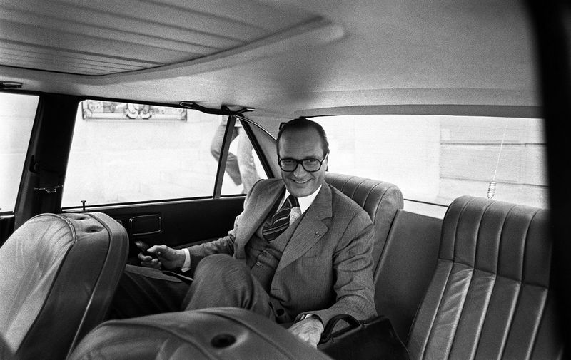 (FILES) This file photo taken on April 20, 1976 shows French Prime Minister Jacques Chirac in his new 604 Peugeot car in Paris. - Former French President Jacques Chirac has died at the age of 86, it was announced on September 26, 2019. (Photo by - / AFP)