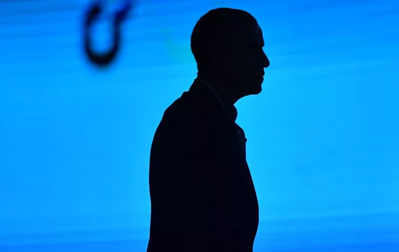 US former President Barack Obama is silhouetted as he leaves the stage at the end of his speech during the third edition of "Seed &amp; Chips: The Global Food Innovation Summit" focussing on new technologies for feeding the globe, from agriculture to distribution, on May 9, 2017 in Milan.  / AFP PHOTO / Andreas SOLARO