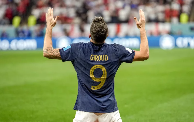 France's Olivier Giroud celebrates after scoring his side's second goal during the World Cup quarterfinal soccer match between England and France, at the Al Bayt Stadium in Al Khor, Qatar, Saturday, Dec. 10, 2022. (AP Photo/Christophe Ena)