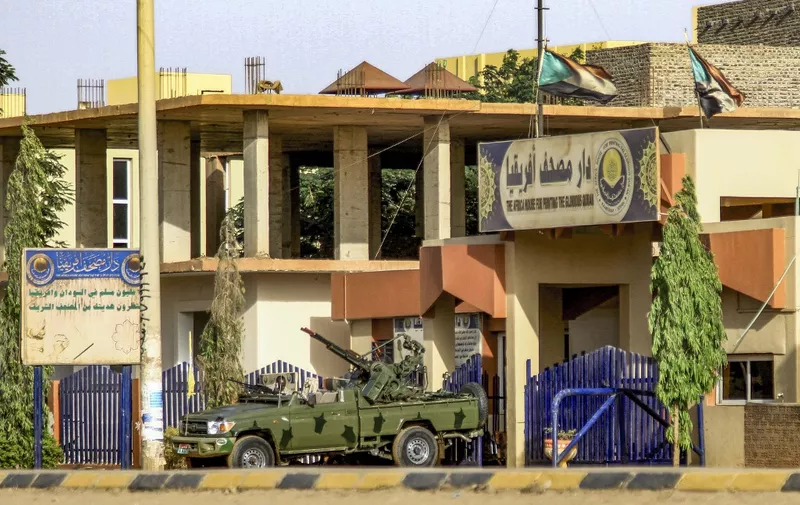 A "technical" vehicle (pickup truck mounted with turret) of Sudan's Rapid Support Forces (RSF) paramilitaries is stationed outside the offices of Dar al-Mushaf (African Holy Koran Publishing House), in the south of Sudan's capital Khartoum on April 17, 2023. (Photo by AFP)