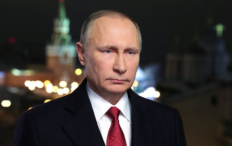 Russian President Vladimir Putin makes his New Year's address to the nation in Moscow's Kremlin, December 31, 2016. / AFP PHOTO / Sputnik / Mikhail KLIMENTIEV