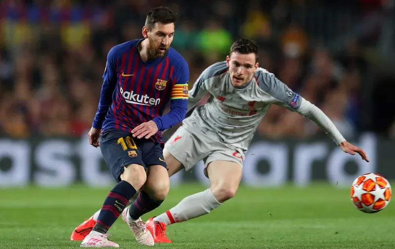 BARCELONA, SPAIN - MAY 01:  Lionel Messi of Barcelona battles for possession with Andy Robertson of Liverpool  during the UEFA Champions League Semi Final first leg match between Barcelona and Liverpool at the Nou Camp on May 01, 2019 in Barcelona, Spain. (Photo by Catherine Ivill/Getty Images)
