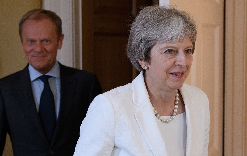 Britain's Prime Minister Theresa May (R) with European Council President Donald Tusk inside 10 Downing Street in central London on June 25, 2018, at the start of their meeting. (Photo by Leon Neal / POOL / AFP)