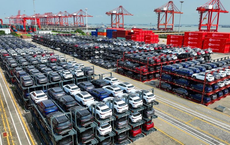 In this photo taken on September 11, 2023, BYD electric cars waiting to be loaded on a ship are stacked at the international container terminal of Taicang Port at Suzhou Port, in Chinas eastern Jiangsu Province. (Photo by AFP) / China OUT