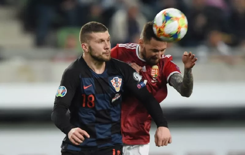 Croatia's forward Ante Rebic (L) vies with Hungary's defender Tamas Kadar during the UEFA Euro 2020 football 1st round Groupe E qualification match between Hungary and Croatia on March 24, 2019 in Budapest. (Photo by ATTILA KISBENEDEK / AFP)