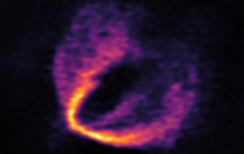 ALMA has uncovered convincing evidence that three young planets are in orbit around the infant star HD 163296. Using a novel planet-finding technique, astronomers have identified three discrete disturbances in the young star’s gas-filled disc: the strongest evidence yet that newly formed planets are in orbit there. These are considered the first planets discovered with ALMA. This image shows part of the ALMA data set at one wavelength and reveals a clear “kink” in the material, which indicates unambiguously the presence of one of the planets.