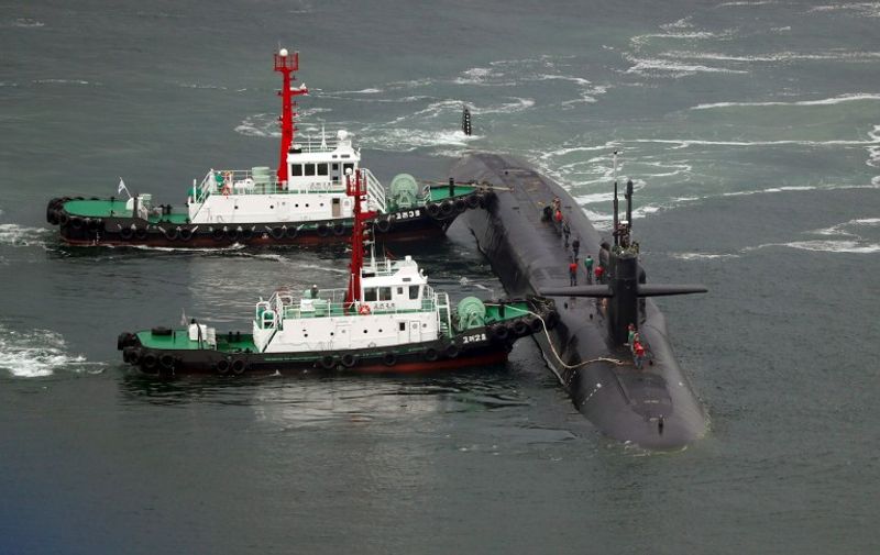 Nuclear-powered submarine USS Michigan approaches at the southeastern port city of Busan on April 25, 2017.
North Korea on April 25, marked a military anniversary with a conventional firing drill, reports said, as South Korea announced joint naval exercises with a US aircraft carrier amid tensions over Pyongyang's nuclear ambitions. / AFP PHOTO / YONHAP / YONHAP /  - South Korea OUT / NO ARCHIVES -  RESTRICTED TO SUBSCRIPTION USE