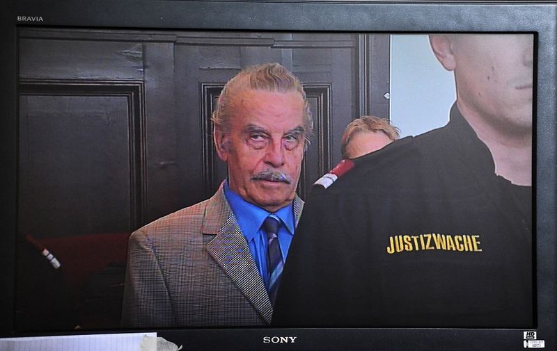 A picture of a TV transmission shows the defendant Jozef Fritzl on March 19, 2009 at the press centre just before the result of trial near the St. Poelten courthouse, some 80 kms west of Vienna, on the last day of the trial. Fritzl was sentenced to life imprisonment and will be placed in a mental institution, the Austrian court hearing his incest and murder trial ruled today.    AFP PHOTO/ SAMUEL KUBANI (Photo by SAMUEL KUBANI / AFP)