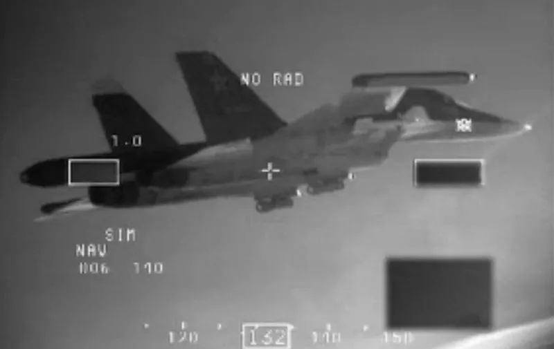 A handout photo released on December 11, 2014 by the Dutch Defence ministry shows one of the two Russian SU-34 "Fullback" bombers being intercepted by Dutch F-16's over the Baltic Sea on December 8. The two bombers were flying in international airspace in the direction of the Russian enclave of Kaliningrad, wedged between Poland and the Baltic states. The planes transponders, which identifies them on radar, had been switched off. "The F-16 escorted the bombers until they were outside of international airspace," the statement said. It is the second time Dutch fighters intercepted Russian planes since being stationed in Poland in early September as part of the Baltic Air Policing mission.  AFP PHOTO / HO / Dutch Ministry of Defence 

= RESTRICTED TO EDITORIAL USE - MANDATORY CREDIT  "AFP PHOTO / HO / Dutch Ministry of Defence" - NO MARKETING NO ADVERTISING CAMPAIGNS - DISTRIBUTED AS A SERVICE TO CLIENTS = / AFP / DUTCH MINISTRY OF DEFENCE / -