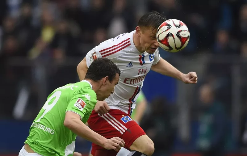 Hamburg's Croatian forward Ivica Olic (R) and Wolfsburg's Croatian midfielder Ivan Perisic vie for the ball during the German first division Bundesliga football match Hamburger SV vs VfL Wolfsburg in Hamburg, northern Germany, on April 11, 2015. AFP PHOTO / TOBIAS SCHWARZ

RESTRICTIONS - DFL RULES TO LIMIT THE ONLINE USAGE DURING MATCH TIME TO 15 PICTURES PER MATCH. IMAGE SEQUENCES TO SIMULATE VIDEO IS NOT ALLOWED AT ANY TIME. FOR FURTHER QUERIES PLEASE CONTACT DFL DIRECTLY AT + 49 69 650050.