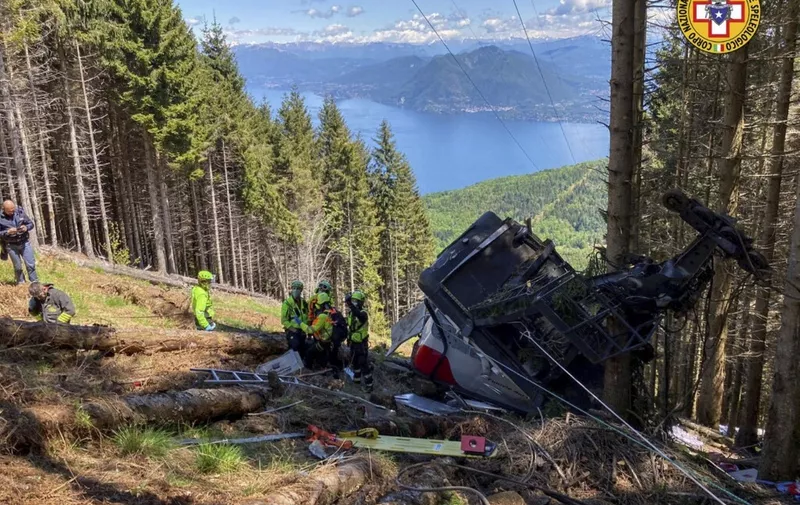 A photo taken and handout on May 23, 2021 by The Italian National Alpine and Speleological Rescue Corps (Corpo Nazionale Soccorso Alpino e Speleologico) shows a cable car that crashed to the ground in the resort town of Stresa on the shores of Lake Maggiore in the Piedmont region. - Eight people died and another two were seriously injured Sunday after a cable car crashed to the ground in northern Italy, emergency services said. (Photo by Handout / Corpo Nazionale Soccorso Alpino e Speleologico / AFP) / RESTRICTED TO EDITORIAL USE - MANDATORY CREDIT "AFP PHOTO / CORPO NAZIONALE SOCCORSO ALPINO E SPELEOLOGICO / HANDOUT " - NO MARKETING - NO ADVERTISING CAMPAIGNS - DISTRIBUTED AS A SERVICE TO CLIENTS