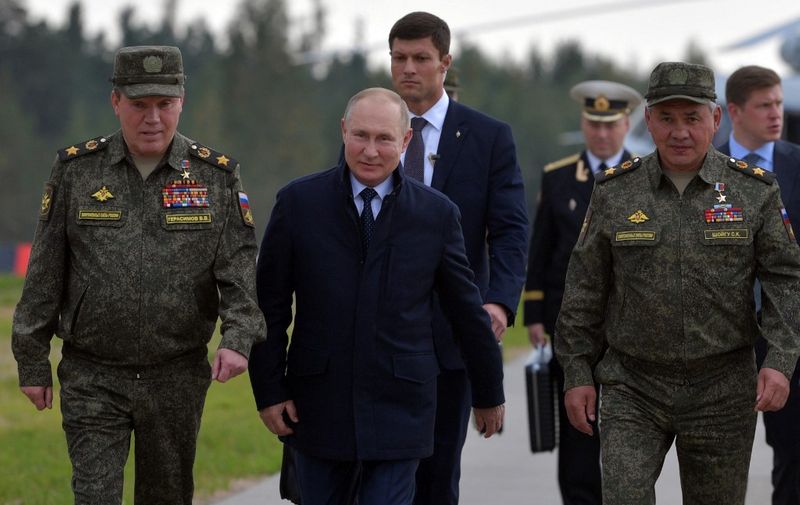 Russian President Vladimir Putin, accompanied by Defence Minister Sergei Shoigu, inspects the "Zapad-2021" joint military drills of the armed forces of the Russian Federation and the Republic of Belarus at the Mulino army base in the Nizhny Novgorod region, some 350 kilometers east of Moscow, on September 13, 2021. (Photo by Alexey DRUZHININ / SPUTNIK / AFP)