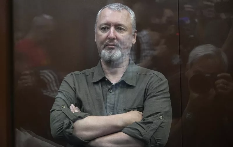 Igor Girkin (Strelkov), the former top military commander of the self-proclaimed "Donetsk People's Republic" and nationalist blogger, detained earlier Friday and accused of extremism, sits inside a glass defendants' cage during a hearing to consider a request on his pre-trial arrest in Moscow on July 21, 2023. (Photo by Alexander Zemlianichenko / POOL / AFP)