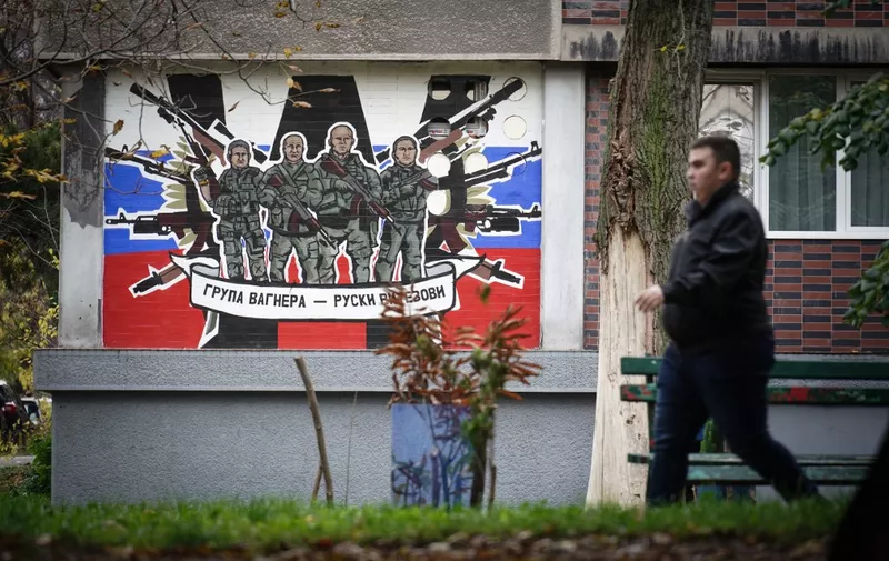 A pedestrian walks past a mural depicting Russia's para military mercenaries 'Wagner Group' reading : "Wagner Group - Russian knights" on a building's wall in Belgrade, on November 17, 2022. - A group of Russian children of all ages clamour cheerfully in a Belgrade apartment, proudly shouting out the new Serbian words they learned to their teacher.
These kids all have one thing in common. Their parents fled the country after Russian President Vladimir Putin's invasion of Ukraine and are now preparing to stay in the Balkan country for the long haul. (Photo by OLIVER BUNIC / AFP)